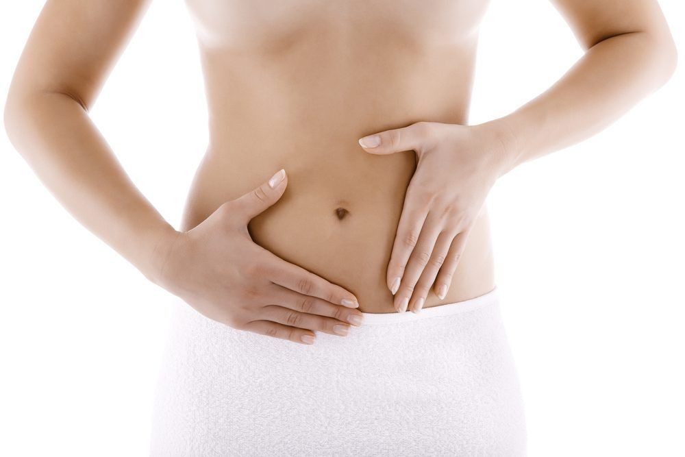 Hands resting gently on the abdomen